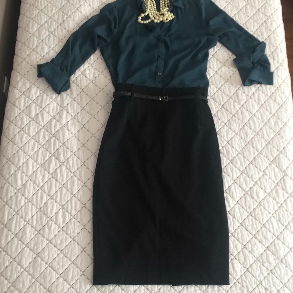 High-waisted, black pencil skirt. Hits below knee.
